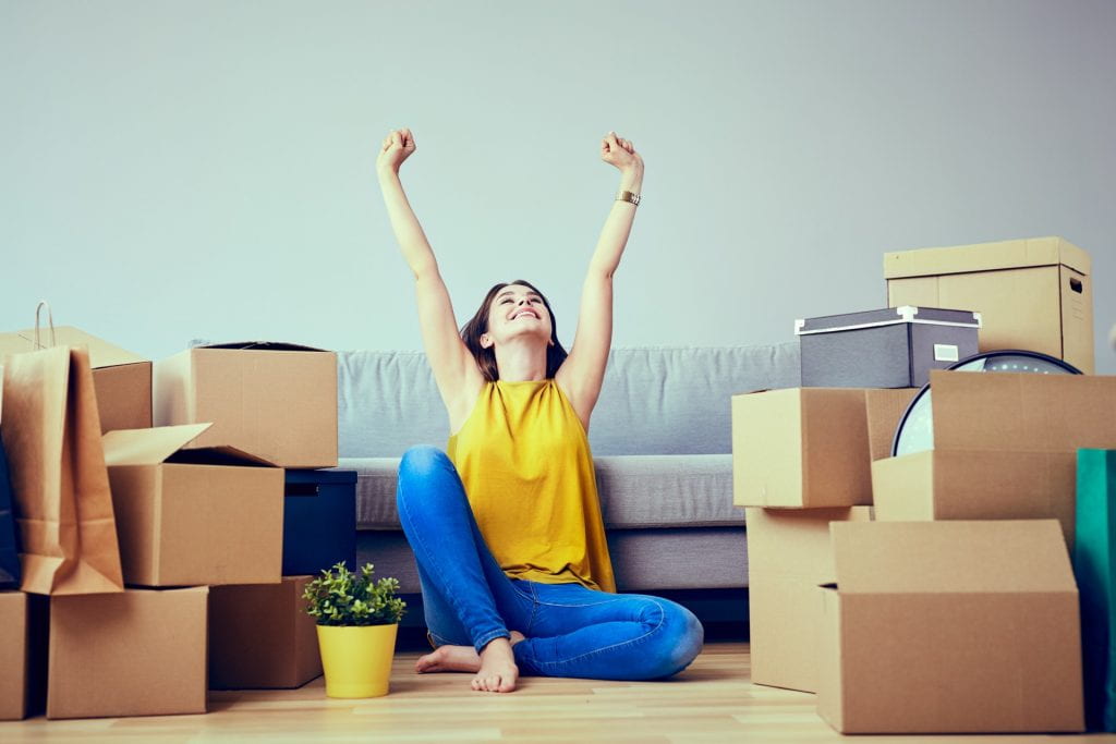 Woman moving with boxes